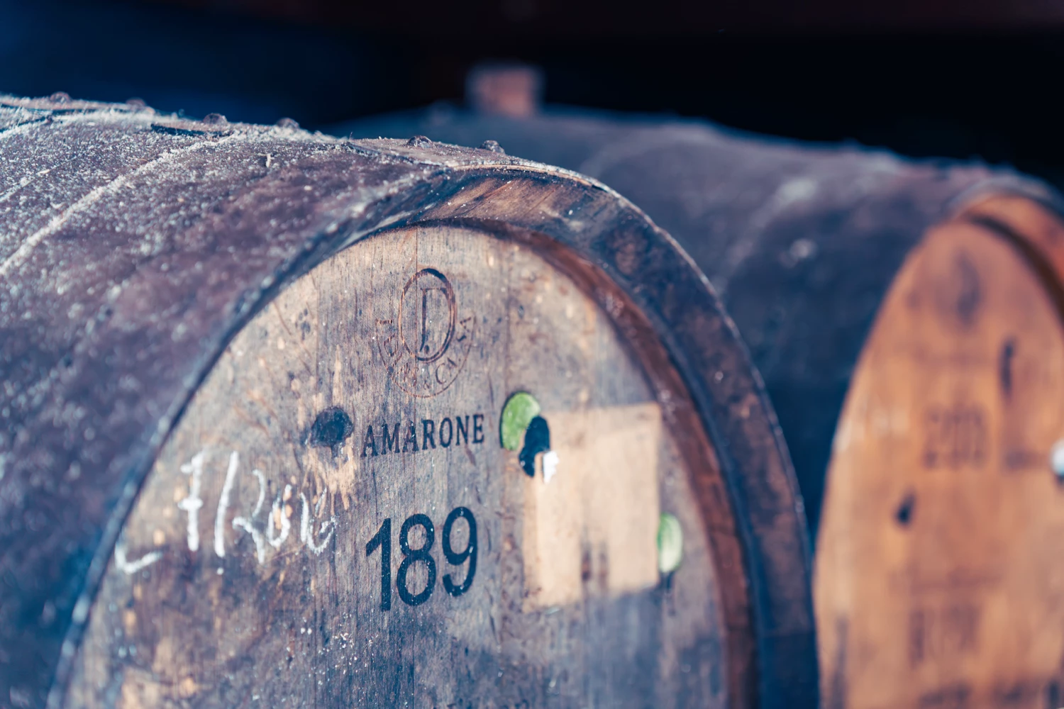 Close-up of a rum barrel marked Amarone in a cellar