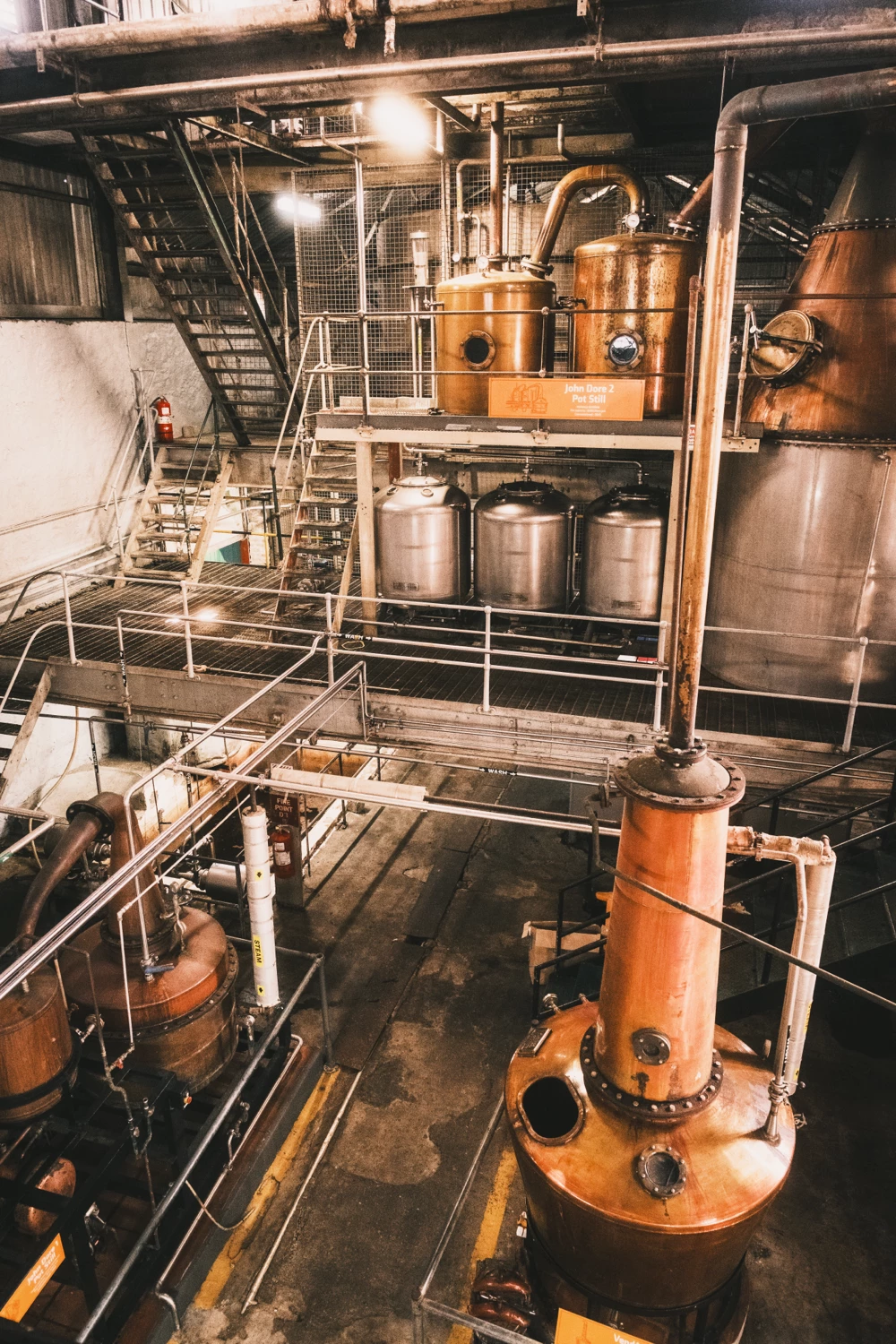 Interior of a rum distillery in St. Lucia with copper and steel equipment